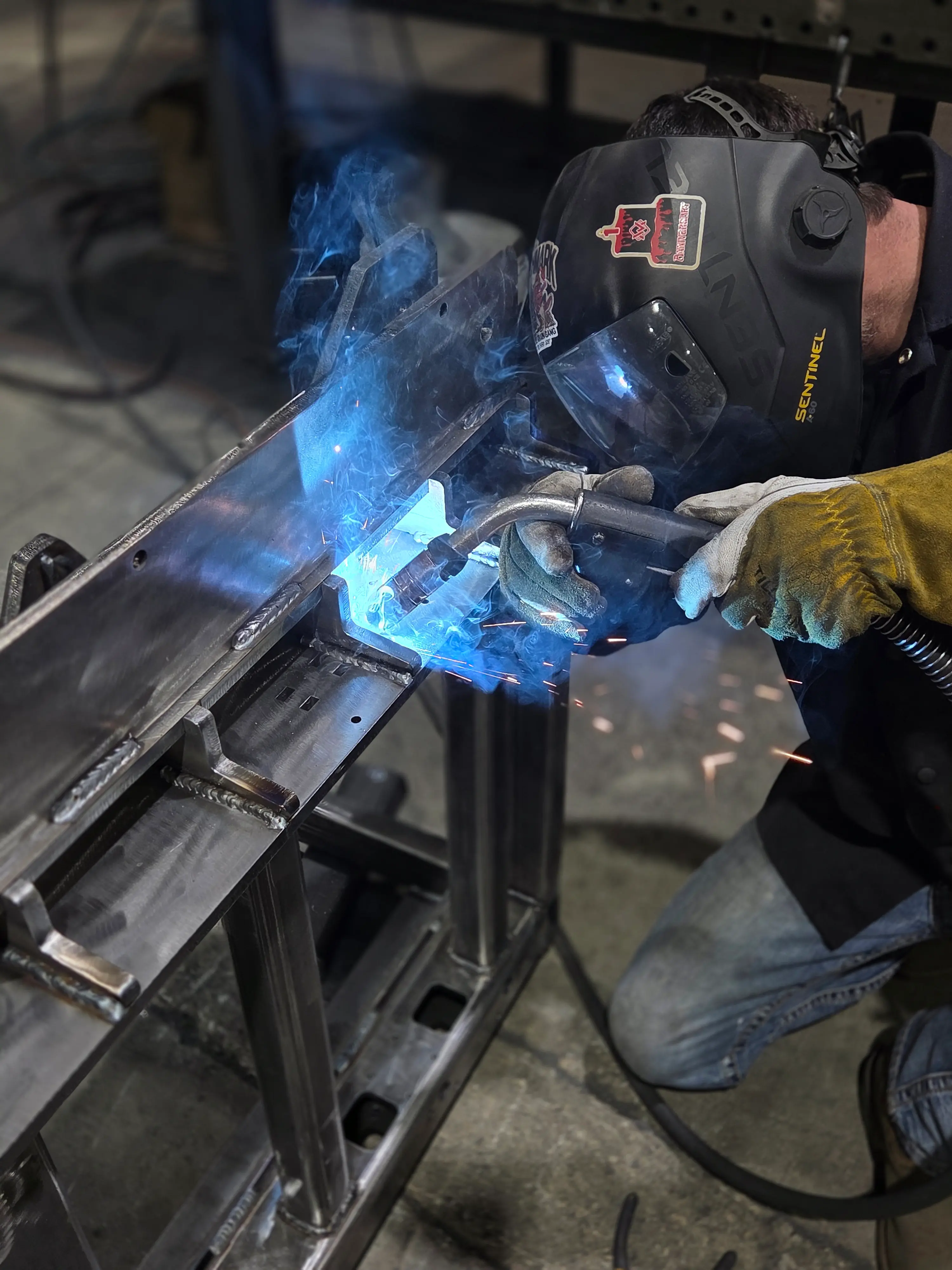 Welder at work in a fabrication shop